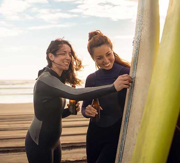 women surfing