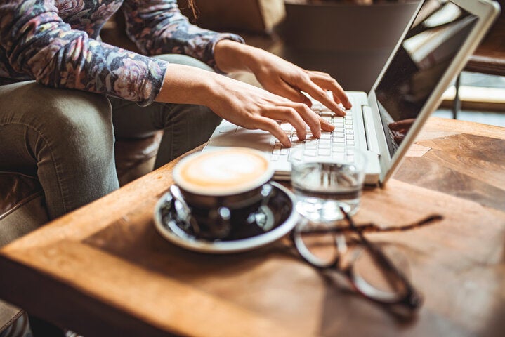woman working with a coffee