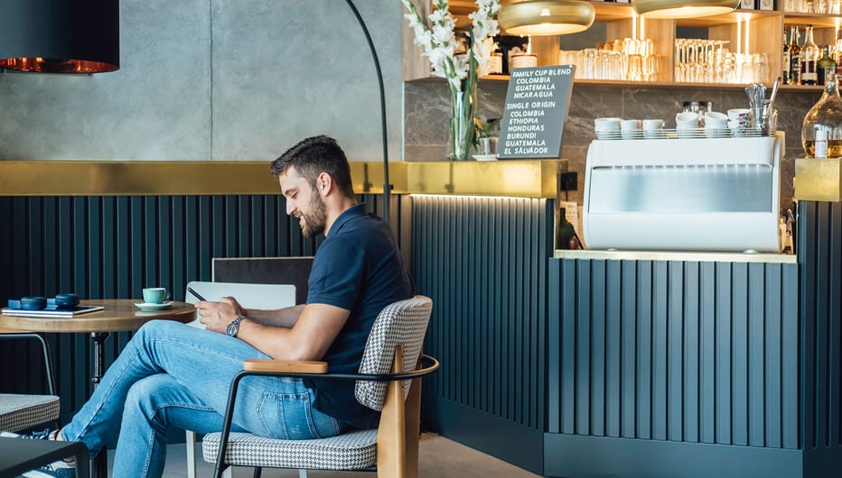 man sitting at cafe