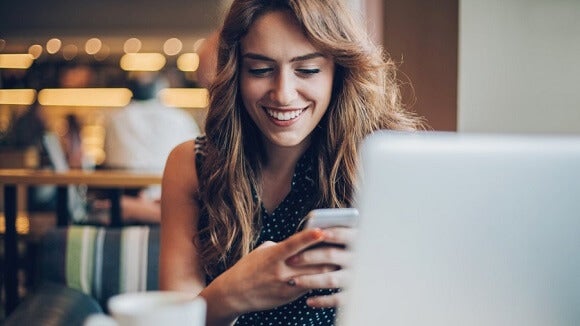 Women-smiling-on-phone Women-smiling-on-phone