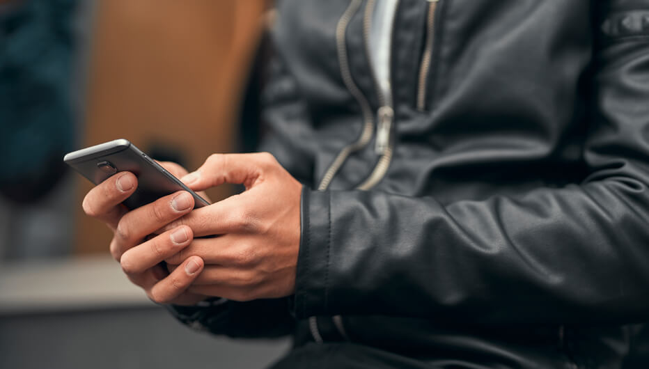 man in jacket on phone