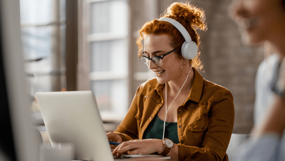 girl with headset and laptop