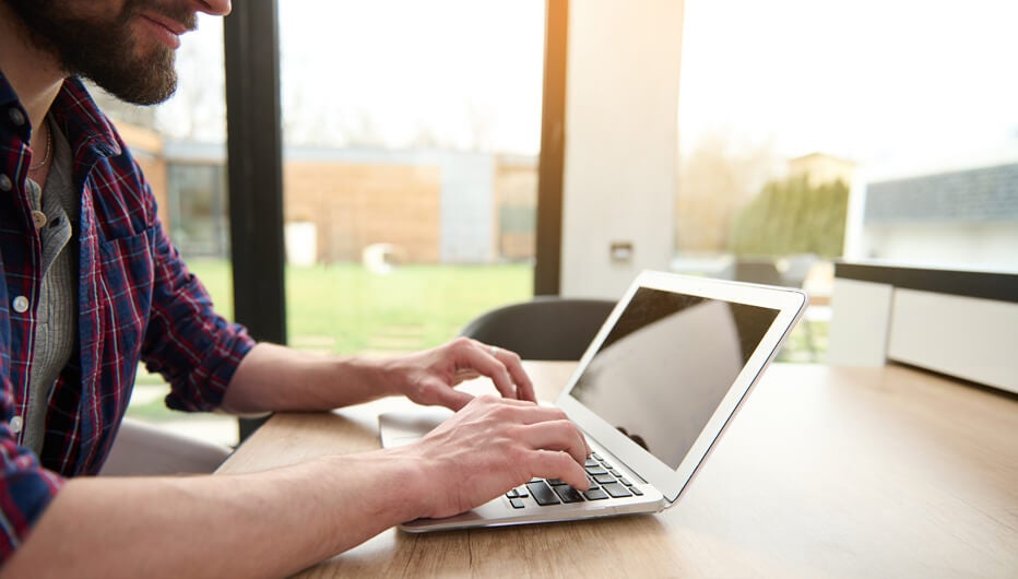 man on laptop at home