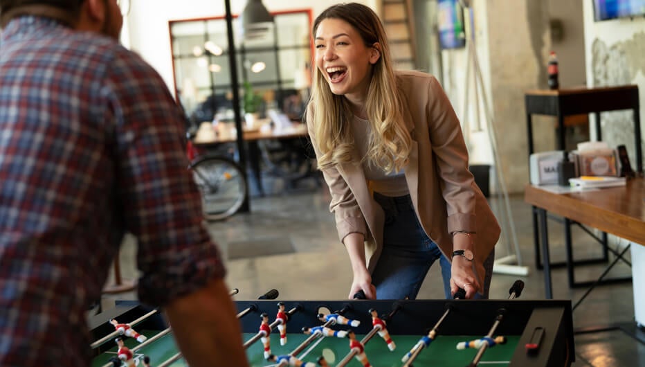 people playing foozball