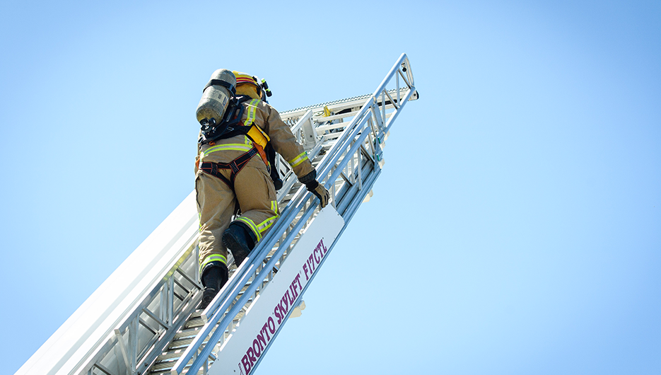 fireman climbing ladder