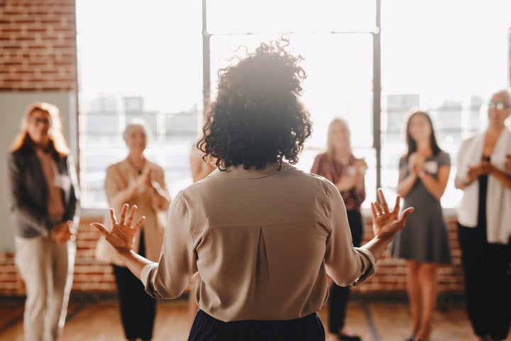 woman presenting with her team