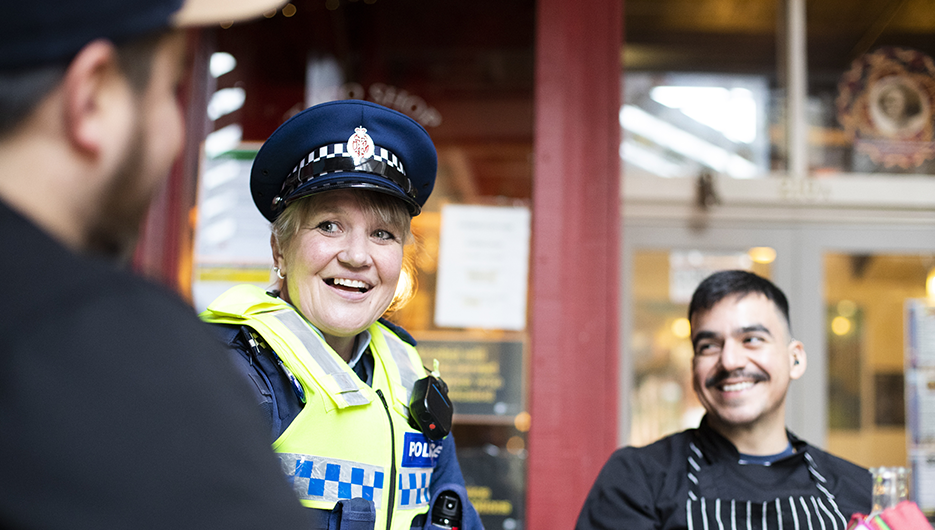 policewoman smiling with a man