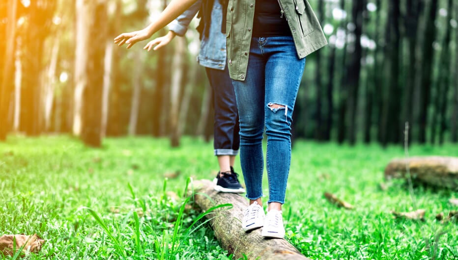 two people walking in log