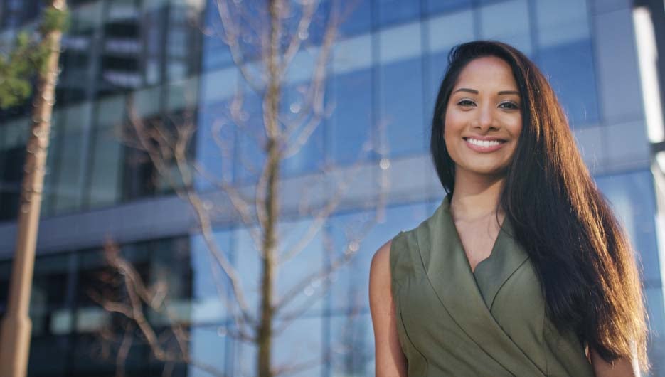 Portrait of attractive female professional outside office building